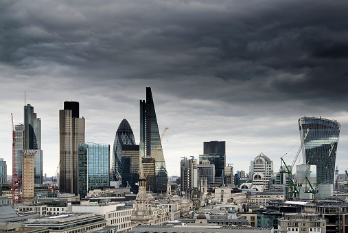 London cityscape skyline with iconic landmark buildings in The City with dramatic stormy sky