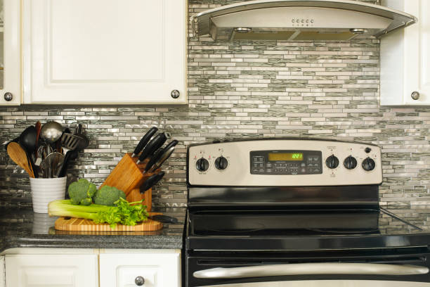 istock Stainless steel stove and kitchen utensils on the cooking table 934778876