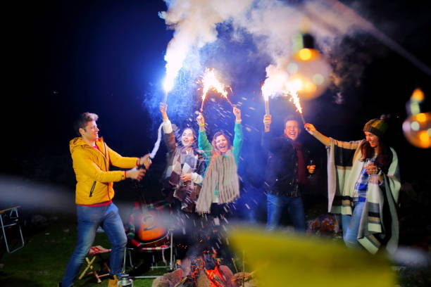 istock Young hipster friends having fun together at beach camping party 934785244