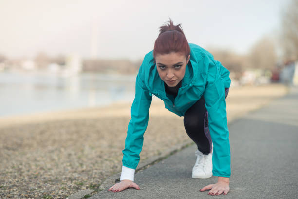 istock Young girl in a start running position 934788050