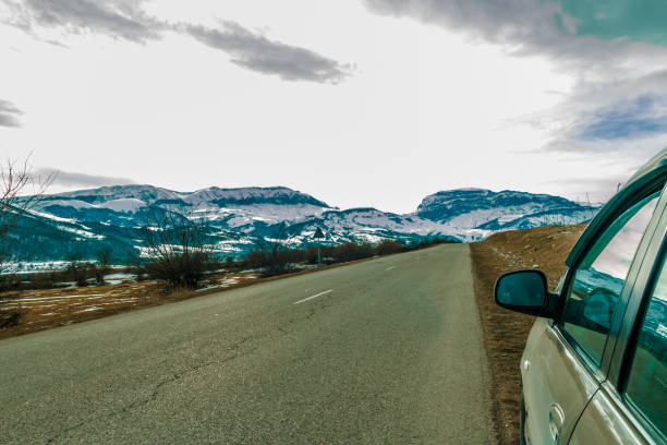 Empty Road to the great mountain with snowy peak. Landscape photography.