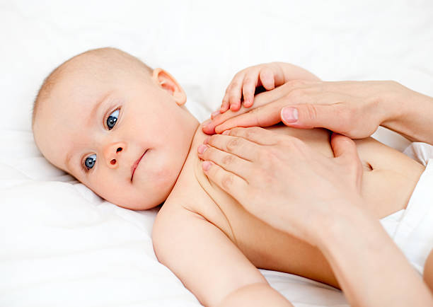 istock An infant getting a full body massage 93479644