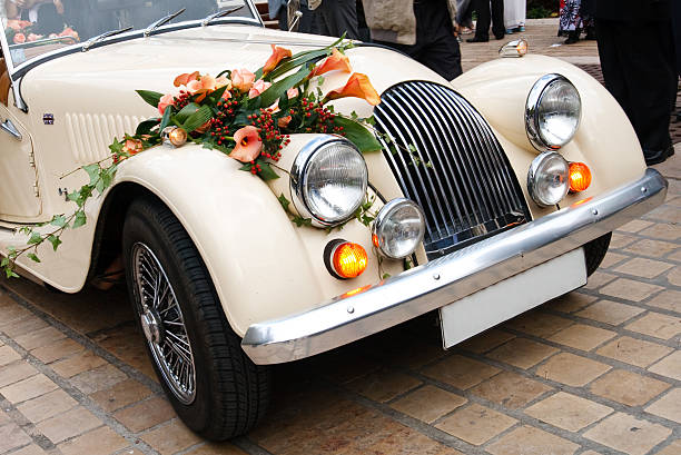 Just married sign and cans attached to convertible car. Horizontal shot.