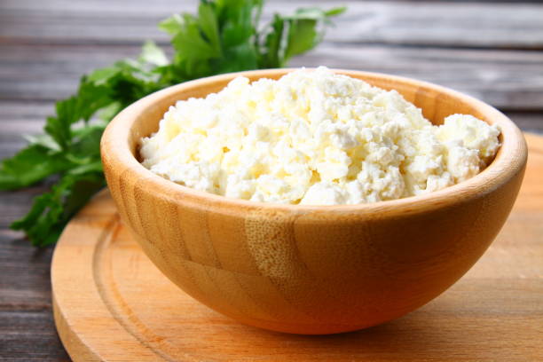 istock Home cottage cheese in a bowl on a wooden table. 934799984
