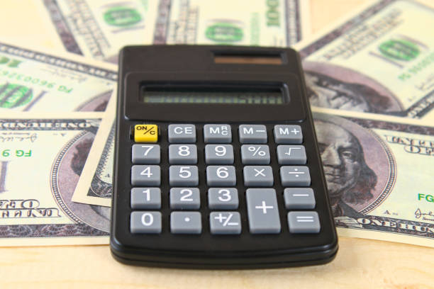 istock Finance concept : The United States hundred-dollar bills , calculator , bills. 934800352