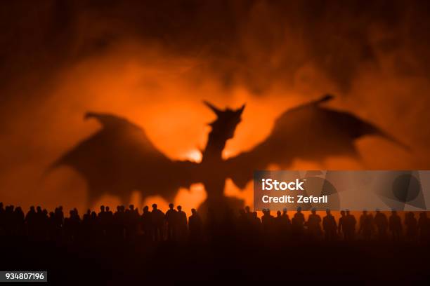 Blurred Silhouette Of Giant Monster Prepare Attack Crowd During Night Selective Focus Decoration Stock Photo - Download Image Now