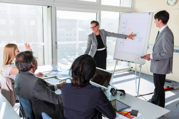 istock People in lecture hall listen to young lecturers 934813262