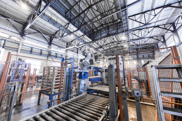 istock Factory workshop interior and machines on glass production background 934819076