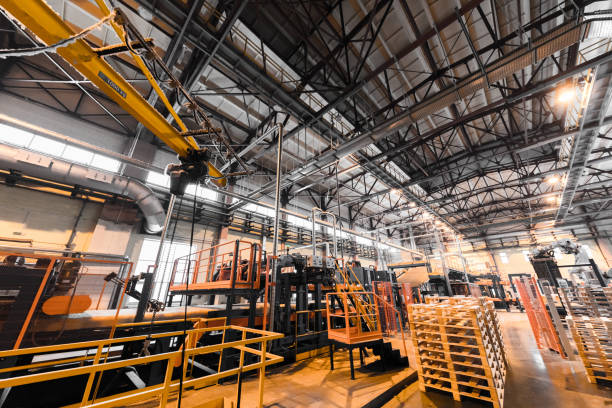 istock Factory workshop interior and machines on glass production background 934819090
