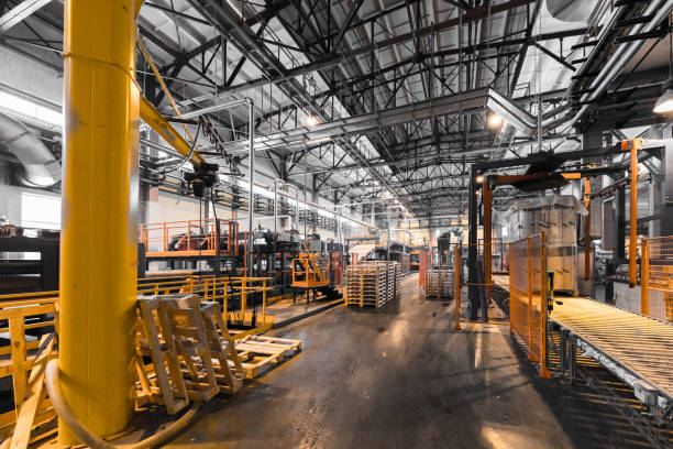 istock Factory workshop interior and machines on glass production background 934819094