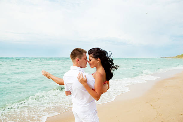 istock Loving couple at the beach 93482239