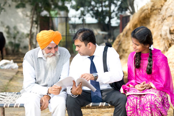 istock Salesperson explaining contract paper to old man 934822736