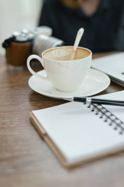 istock a cup of coffee latte has drank on wooden table 934822804