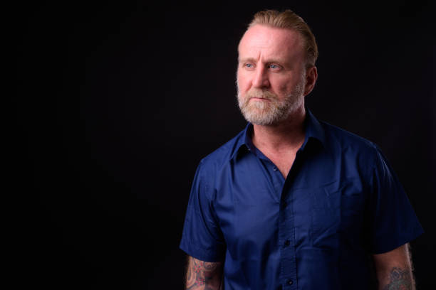 istock Mature Man With Beard And Tattoos Thinking 934822866