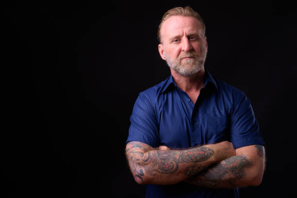 istock Mature Man With Beard And Tattoos 934822874