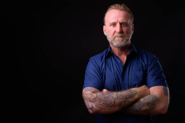 istock Mature Man With Beard And Tattoos 934822896