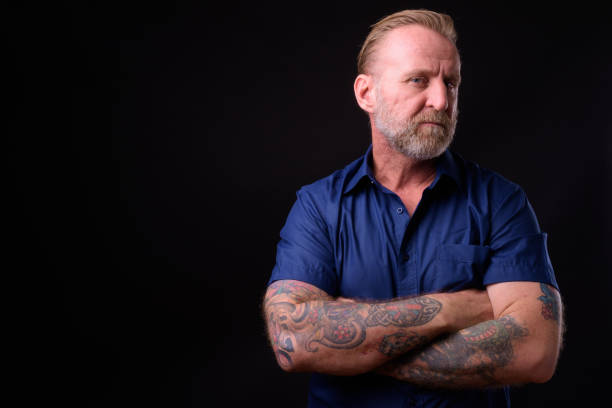 istock Mature Man With Beard And Tattoos 934822936