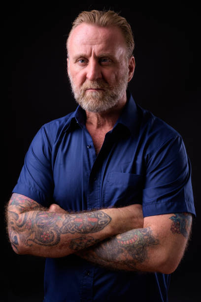 istock Mature Man With Beard And Tattoos 934823154