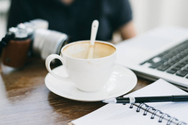 istock a cup of coffee latte has drank on wooden table 934825108