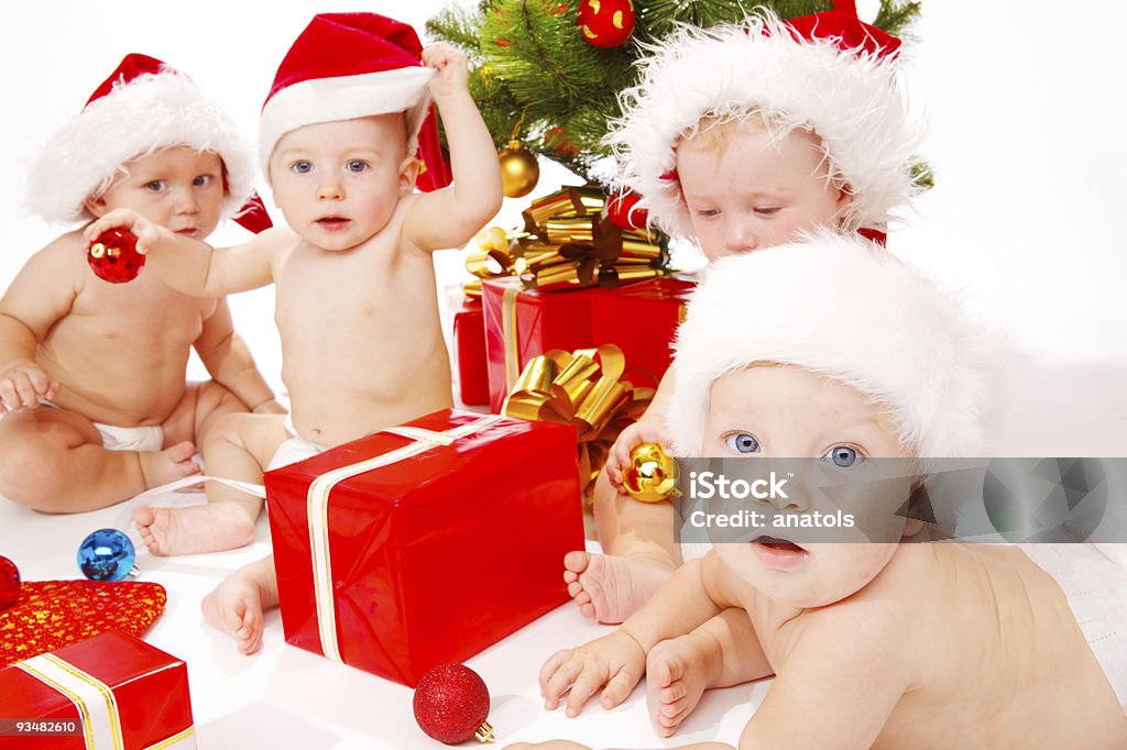 Babies with Christmas presents  Baby - Human Age Stock Photo