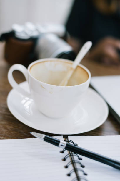 istock a cup of coffee latte has drank on wooden table 934826736