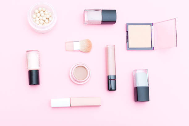 istock Nude cosmetics  and makeup tools on pink background. Flat lay 934826828