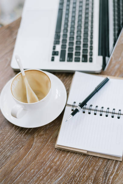 istock a cup of coffee latte has drank on wooden table 934826988