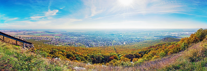 Panoramic view of the Nitra city from Zobor hill, Slovak republic. Seasonal landscape. Autumn forest. Tourism theme. Vivid photo filter.