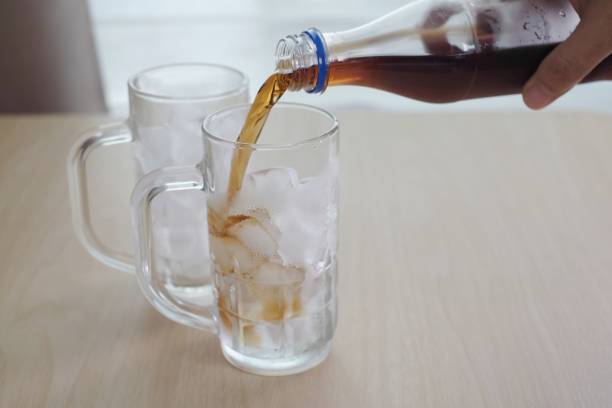 istock Soft drinks  poured in a glass of ice 934827060
