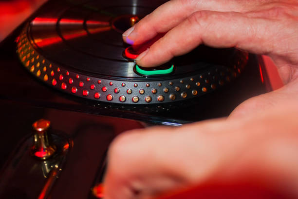 istock Male hands playing dj with toy turntable on a party 934827282