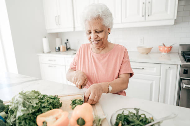 istock Grandmother cooking family dinner 934828370