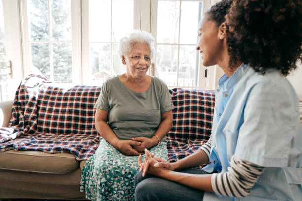 istock Nurse visiting senior lady at home 934829524