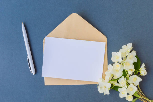 istock Mockup white greeting card and envelope with white jasmine flowers 934835754