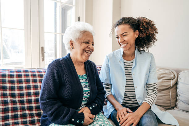 Nurse working in care center Positive assistance for seniors ethiopian ethnicity photos stock pictures, royalty-free photos & images