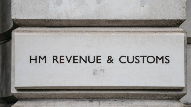 HM Revenue and Customs sign on a building in Whitehall, London, England, UK. London, UK - March 7, 2018: HM Revenue and Customs sign on a building in Whitehall, London, England, UK hm government stock pictures, royalty-free photos & images