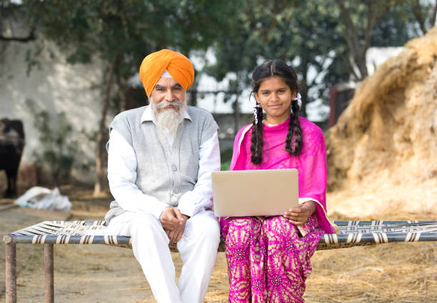 istock Old man with girl using laptop 934847194