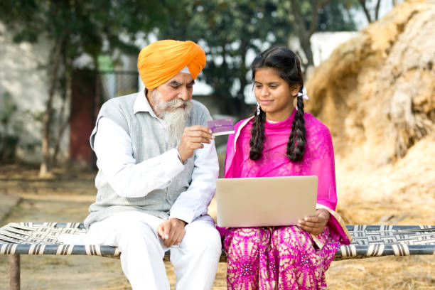 istock Old man with children using laptop and credit card 934847232