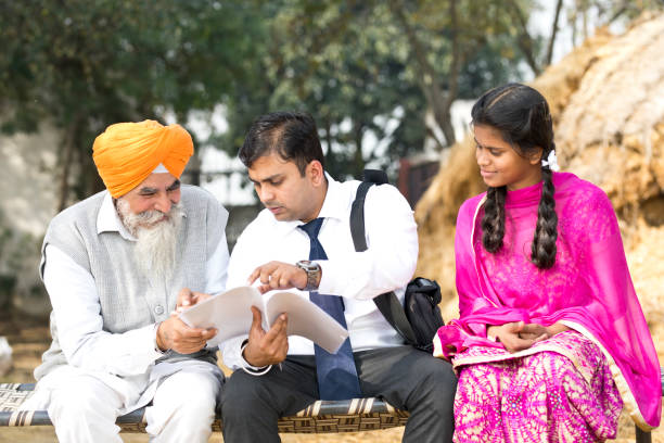 istock Salesperson explaining contract paper to old man 934849556