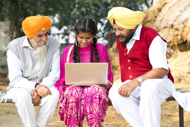 istock Indian men with girl using laptop 934849780