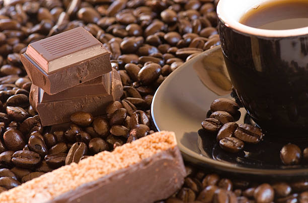Coffee, biscotti, and chocolate stock photo