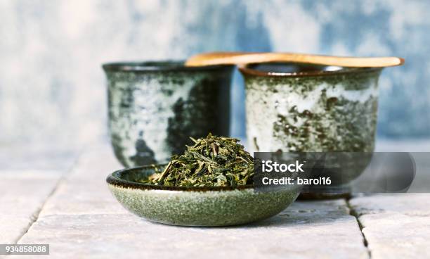 Sencha Green Tea Leaves And Japanese Ceramic Tea Cups Stock Photo - Download Image Now