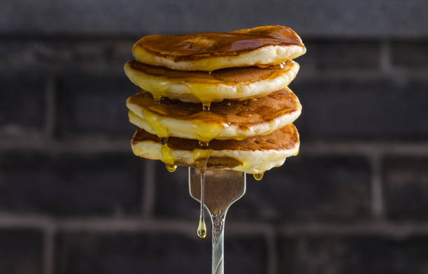 istock American pancake with liquid honey on brick background. Selective focus. 934864834