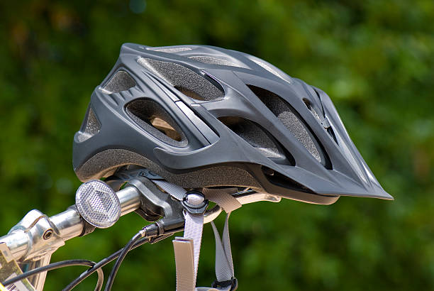 Black Cycling Helmet on Handlebars stock photo