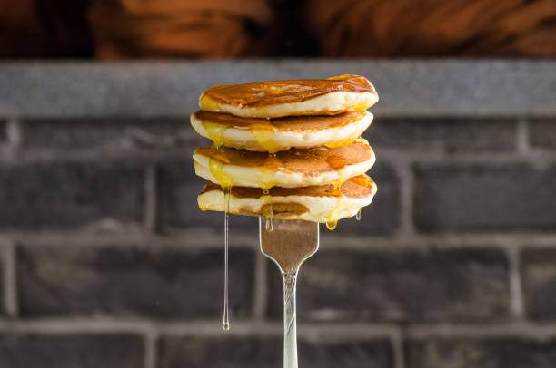istock Pancake with liquid honey on brick background. Selective focus. 934865278