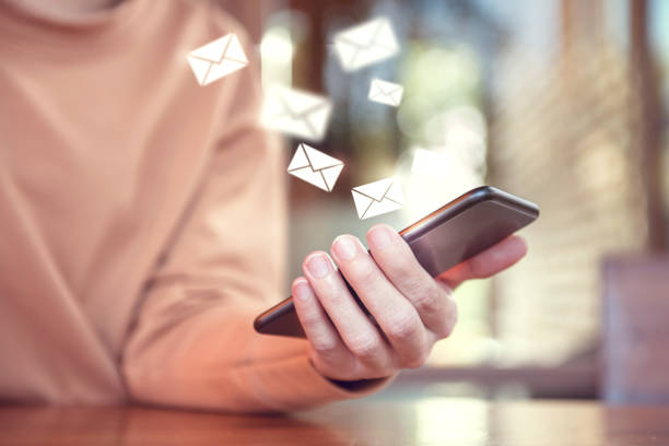 istock Woman hand using mobile smartphone with email icon, Email concept. 934869756