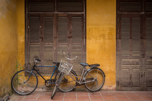 istock Bicycles parked near yellow wall, Hoi An Ancient Town 934874074