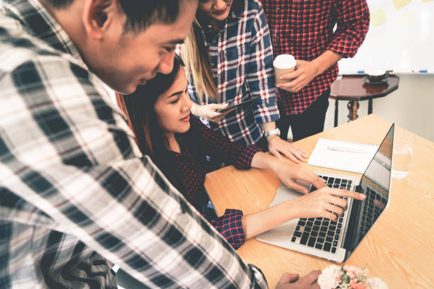 istock Start up business team is working together discussing on laptop 934877112