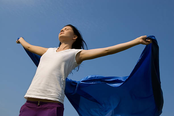 istock Young woman with flying fabric 93487715
