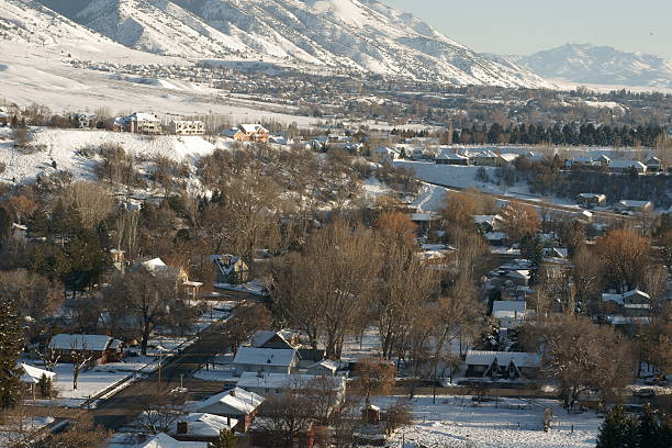 Urban Scene with Snow Covered Mountain Tight stock photo