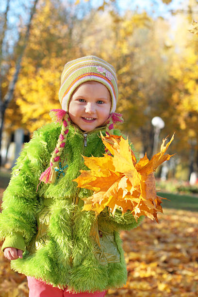 istock girl with autamn leaves 93488113